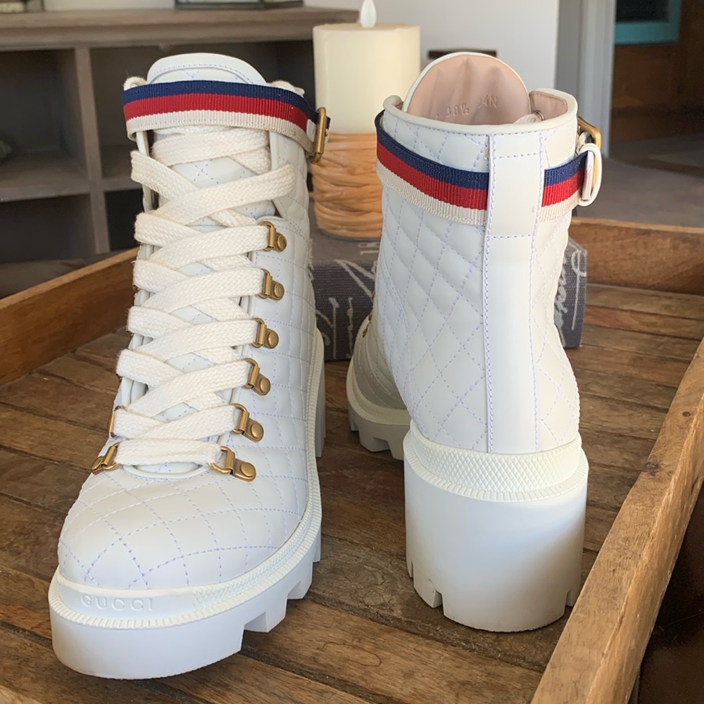 Gucci white quilted leather with red white and blue strap on each.